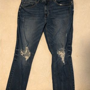 Original Use 40x32 slim taper jeans purposely torn fashionably worn look